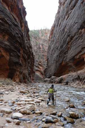 Winter river hiking: Andrea Yu hiking through the Narrows in Zion National Park, Utah