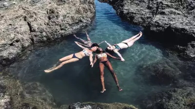 Tourism industry recovery | A group of swimmers with Origin Travels