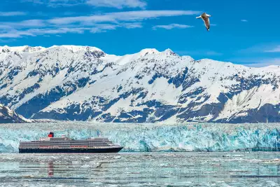 Cunard Cruises | The Cunard Queen Elizabeth travels next to a glacier in Alaska