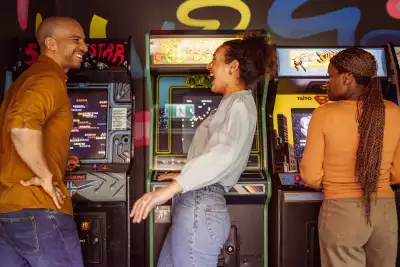 Hotel Zed Tofino | A woman laughs inside the hidden arcade room