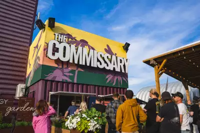 Guests lineup for food at The Commissary at Base31 in Picton, Prince Edward County