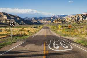 Bucket list ideas for travellers | Scenic panoramic view of long straight road on famous Route 66