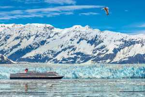 Cunard Cruises | The Cunard Queen Elizabeth travels next to a glacier in Alaska