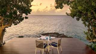 The best things to do in Anguilla | Table overlooking the cliff at Malliouhana