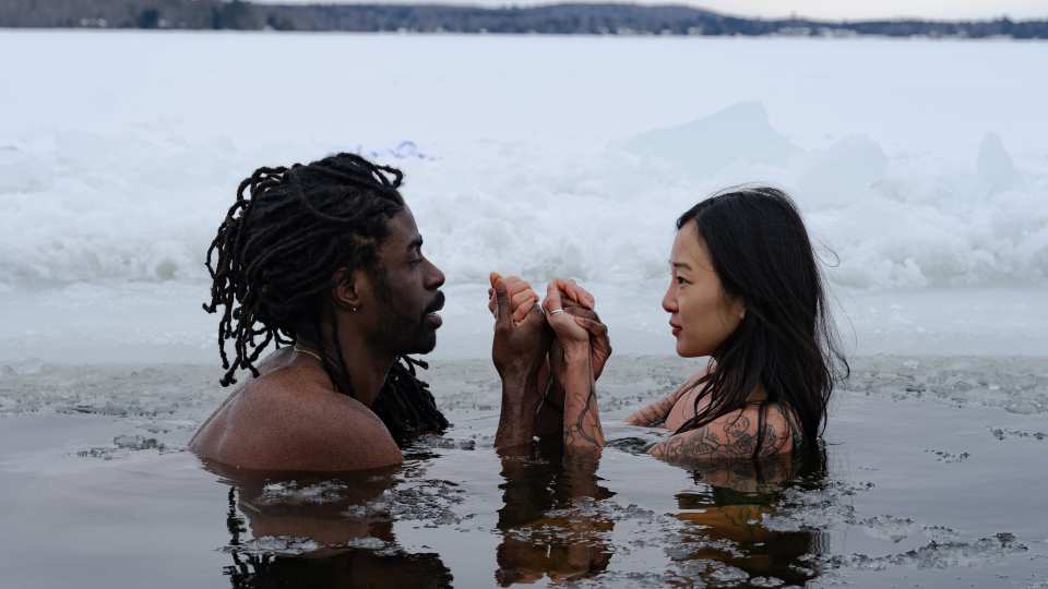 A couple takes a cold plunge at Dimensions Algonquin Highlands