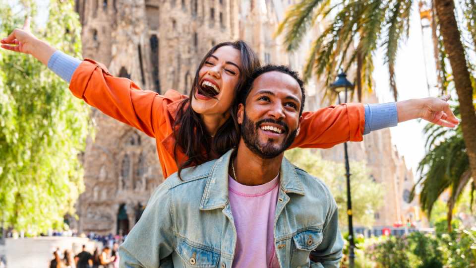 Outdoor Adventure Show, Toronto | A man piggy-backing a woman in a tropical setting