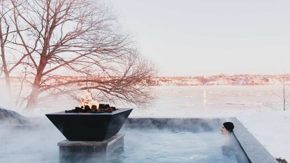 Strom Nordic Spa, Québec | A person sitting in a thermal bath at Strøm Nordic Spa — Old Québec