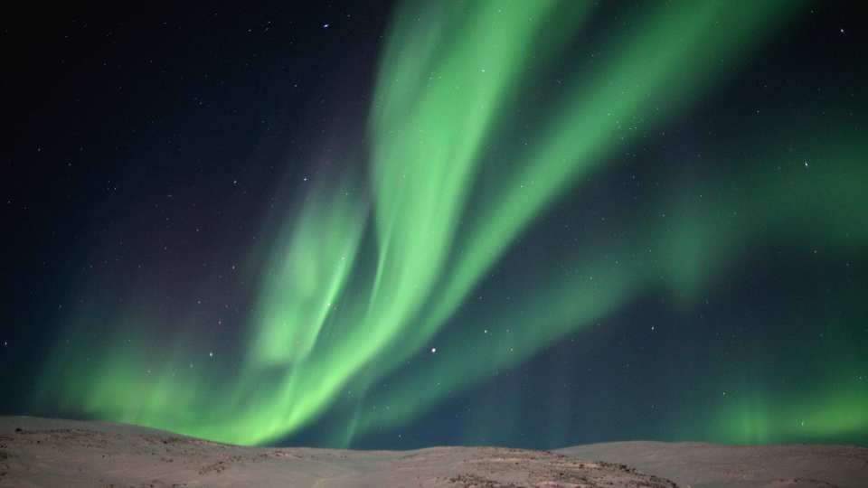 Nunavik | The bright green and sometimes purple ribbons of the aurora borealis (Northern Lights)