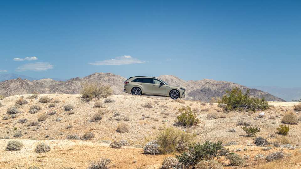 A Mazda CX-70 driving in the desert in Palm Springs, California