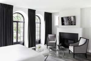 Cold plunge in Kingston | A guest room with a fireplace at the Frontenac Hotel