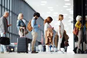 Travel tips | People lined up at the airport
