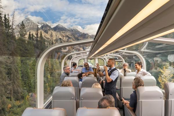 Passengers looking out of the dome aboard the Rocky Mountaineer