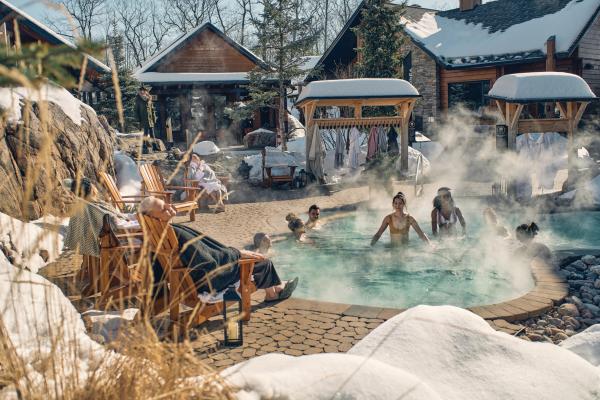 Nordik Spa-Nature - Chelsea, Quebec | People in an outdoor pool at Nordik Spa-Nature - Chelsea