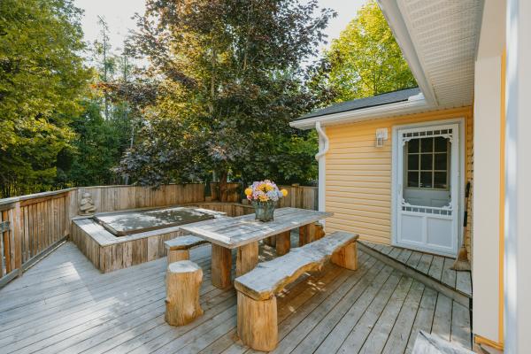 The back deck and hot tub at Wish Lakehouse, waterfront Ontario cottage rental