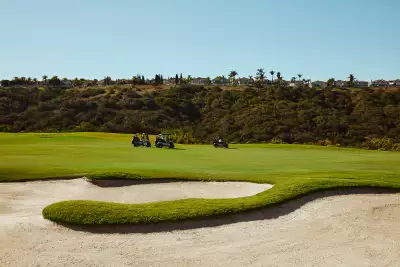 Golf carts drive along the course at Fairmont Grand Del Mar, San Diego