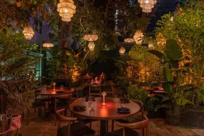 South Beach, Miami, Florida | Lush greenery surrounds a table inside B&acirc;oli