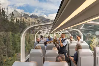 Passengers looking out of the dome aboard the Rocky Mountaineer