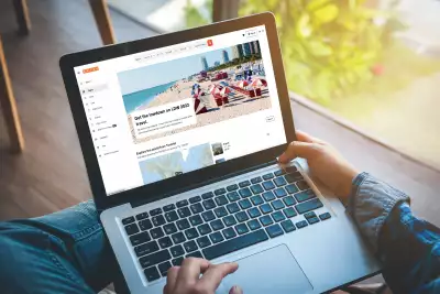 Someone using Kayak's Best Time to Travel tool on the computer