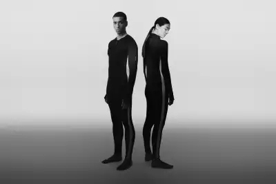 A man and a woman wearing the icebreaker Merino 200 Oasis+ Thermal Suit