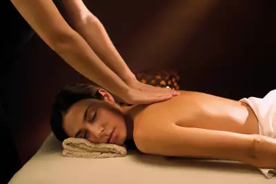 A guest receiving a back massage at Aire Ancient Baths Toronto