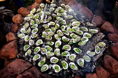 2026 Travel trends | Oysters roasting at The Fireworks Feast in Prince Edward Island