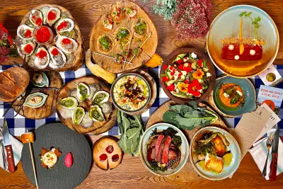 2026 Travel trends | A spread of food from The Fireworks Feast in Prince Edward Island