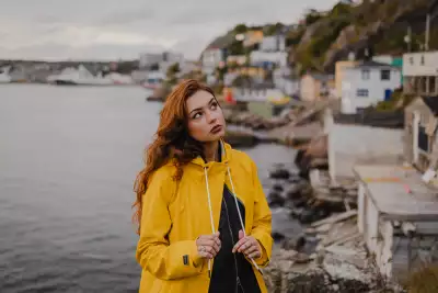 Someone sporting The Mernini raincoat in yellow