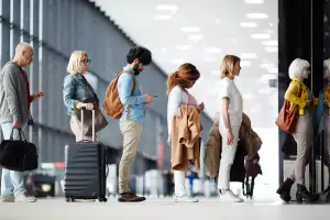 Travel tips | People lined up at the airport