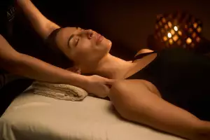 A guest receiving a shoulder massage at Aire Ancient Baths Toronto