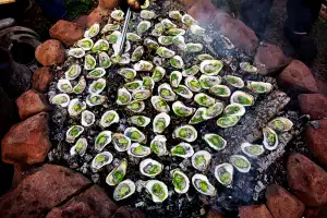 2026 Travel trends | Oysters roasting at The Fireworks Feast in Prince Edward Island