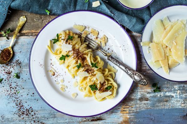Pasta topped with Parmigiano Reggiano from Parma, Italy Pasta topped with Parmigiano Reggiano from Parma, Italy