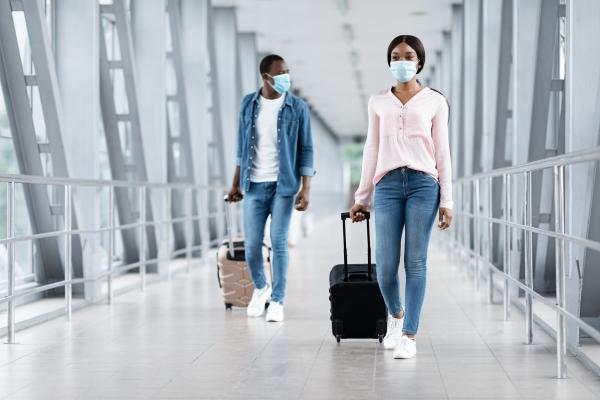Travel tips | People walking through the airport with luggage Travel tips | People walking through the airport with luggage