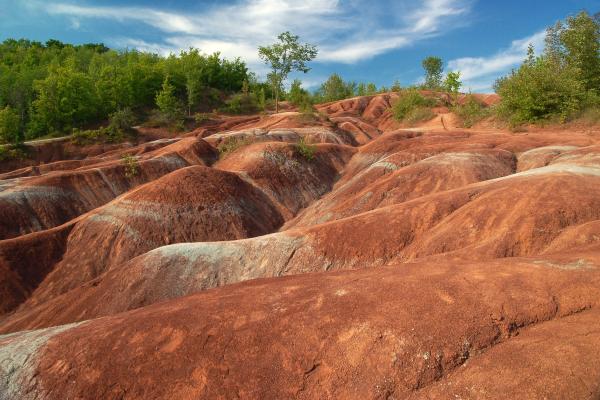 Canadian natural attractions | The rolling red Cheltenham Badlands in Ontario Canadian natural attractions | The rolling red Cheltenham Badlands in Ontario