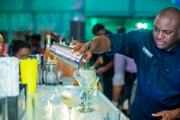 Barbados Rum and Food Festival | A bartender pouring a cocktail Barbados Rum and Food Festival | A bartender pouring a cocktail