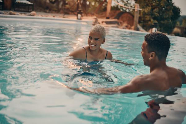 Nordik Spa-Nature - Chelsea, Quebec | Two people in an outdoor pool at Nordik Spa-Nature - Chelsea Nordik Spa-Nature - Chelsea, Quebec | Two people in an outdoor pool at Nordik Spa-Nature - Chelsea