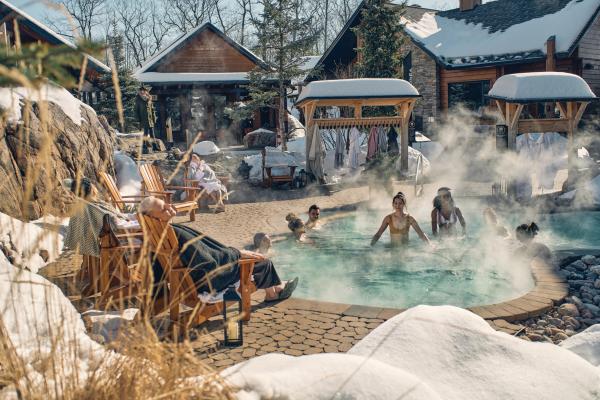 Nordik Spa Village - Chelsea, Quebec | People in an outdoor pool at Nordik Spa Village - Chelsea