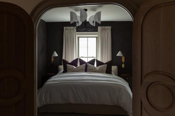 A guest bed at The Kat Florence hotel, Elora