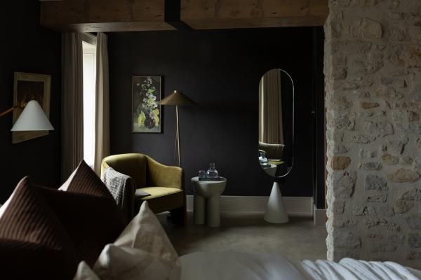 Seating area in a guest room at The Kat Florence Hotel