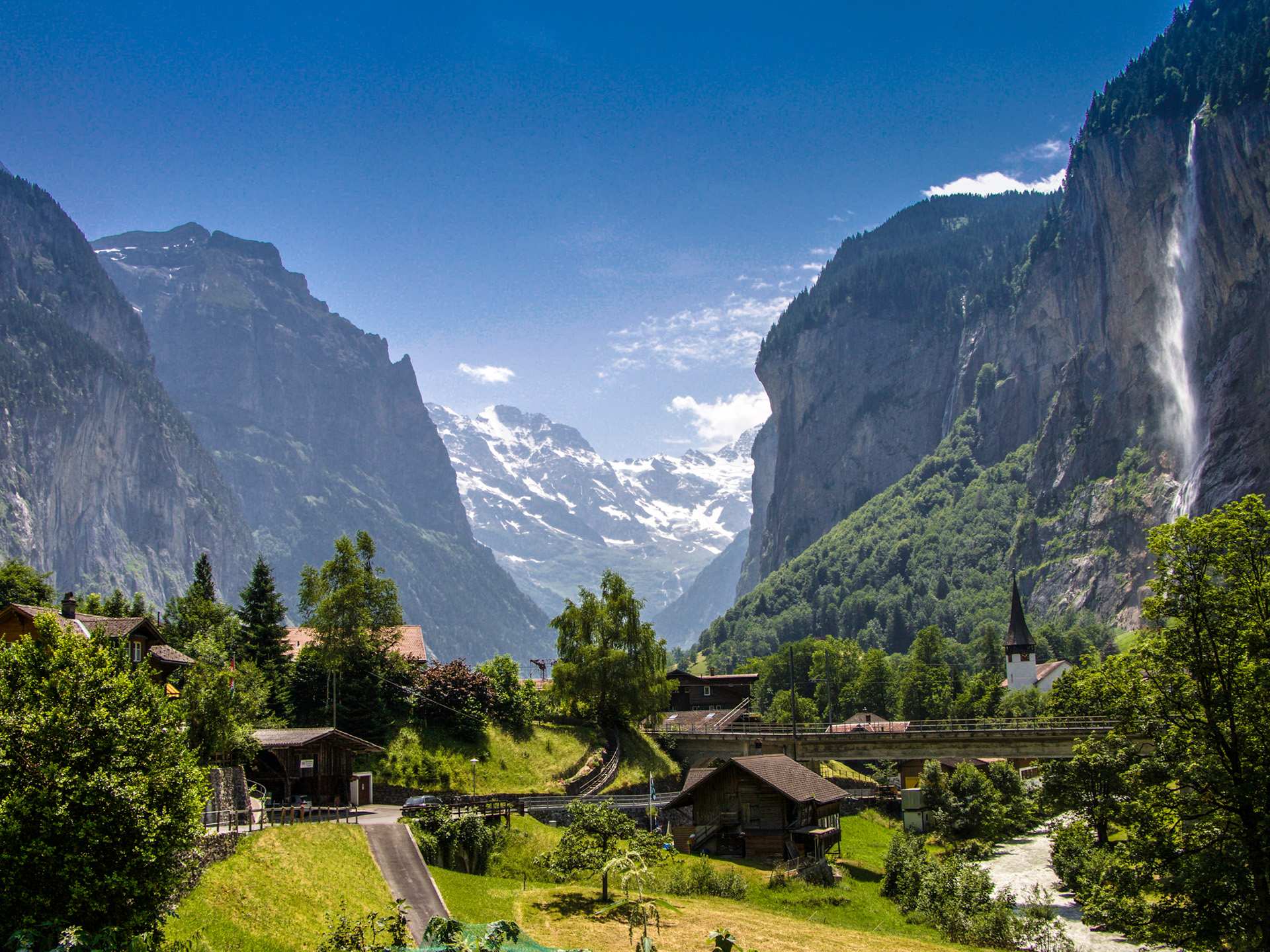 Switzerland Swiss Travel Pass | Buildings and waterfall in Lauterbrunnen