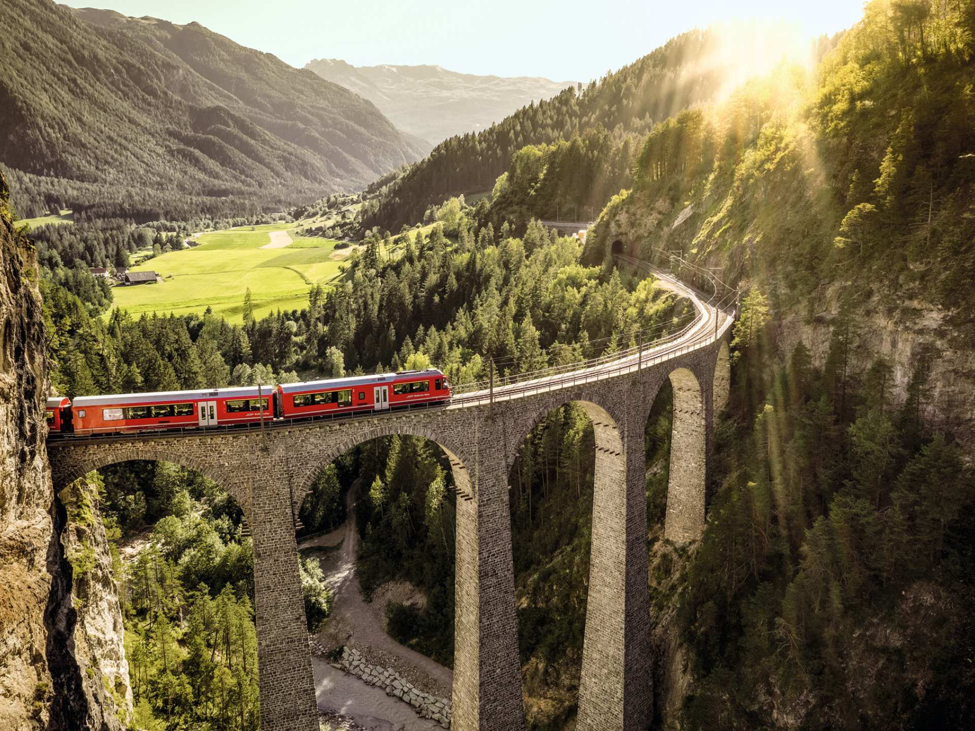 Switzerland Swiss Travel Pass | Train travelling through mountains in Switzerland