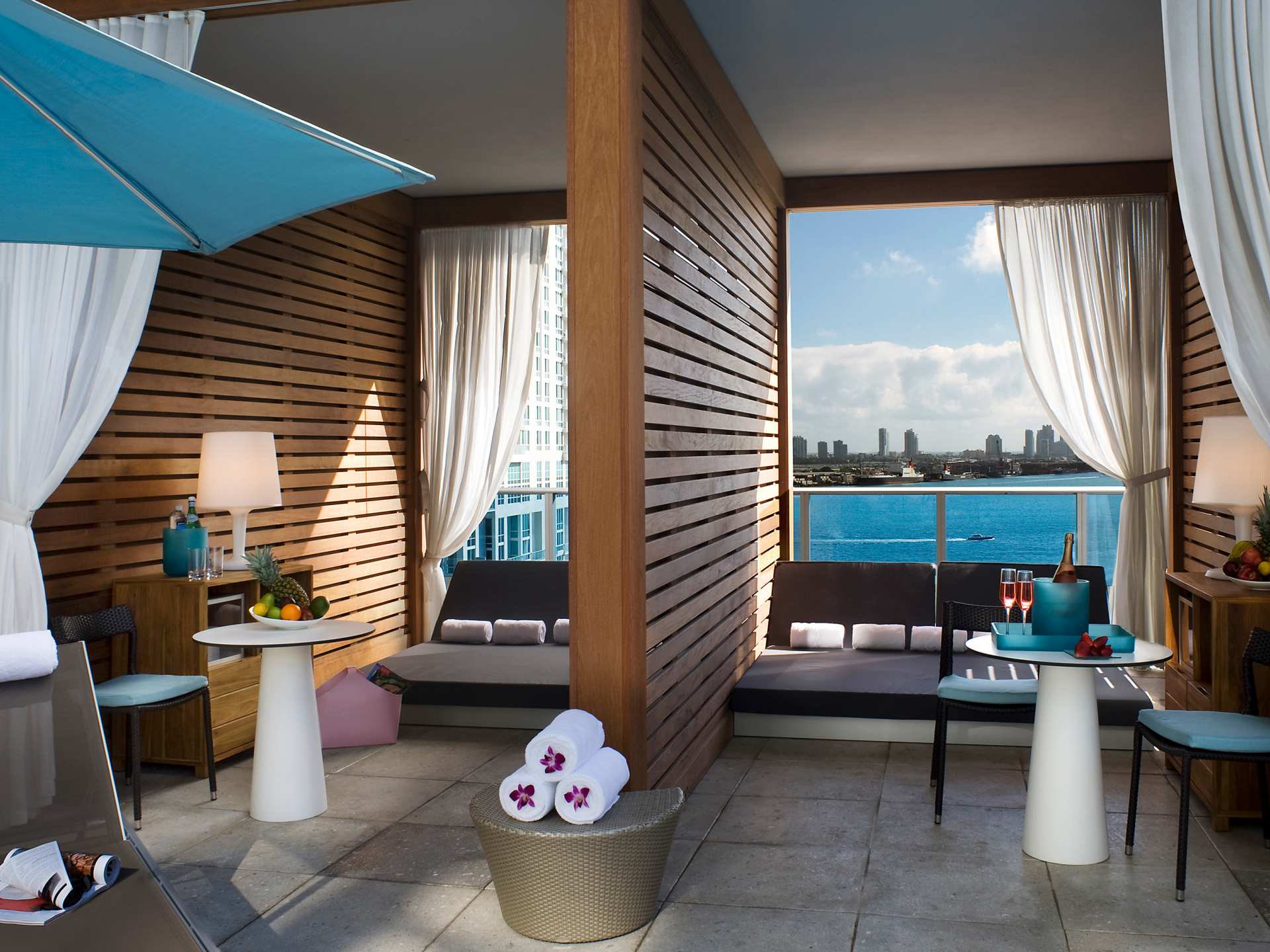 Private cabanas around the rooftop pool at the Kimpton EPIC Miami