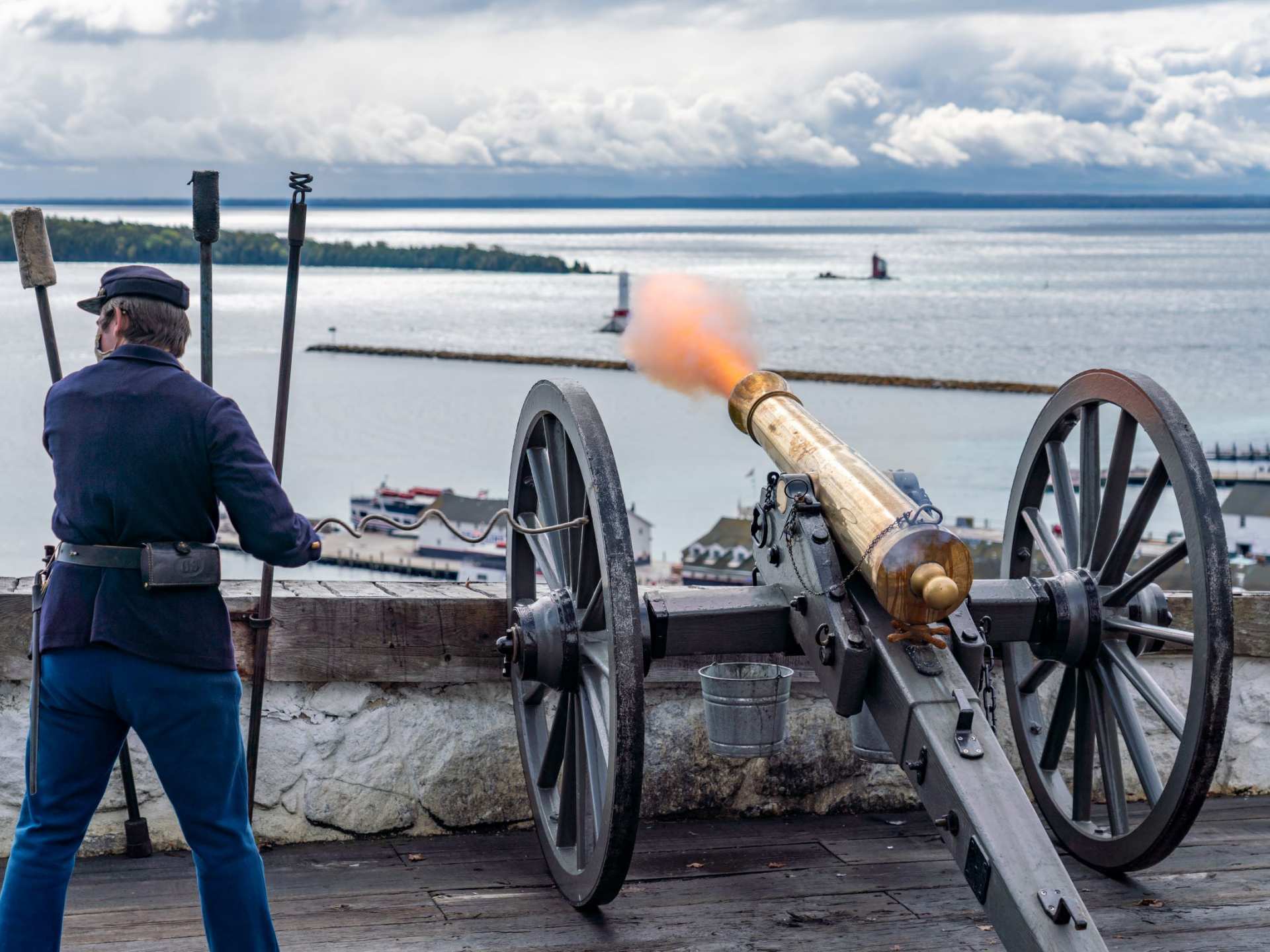 Mission Point | A soldier firing the cannon at Fort Mackinac on Mackinac Island