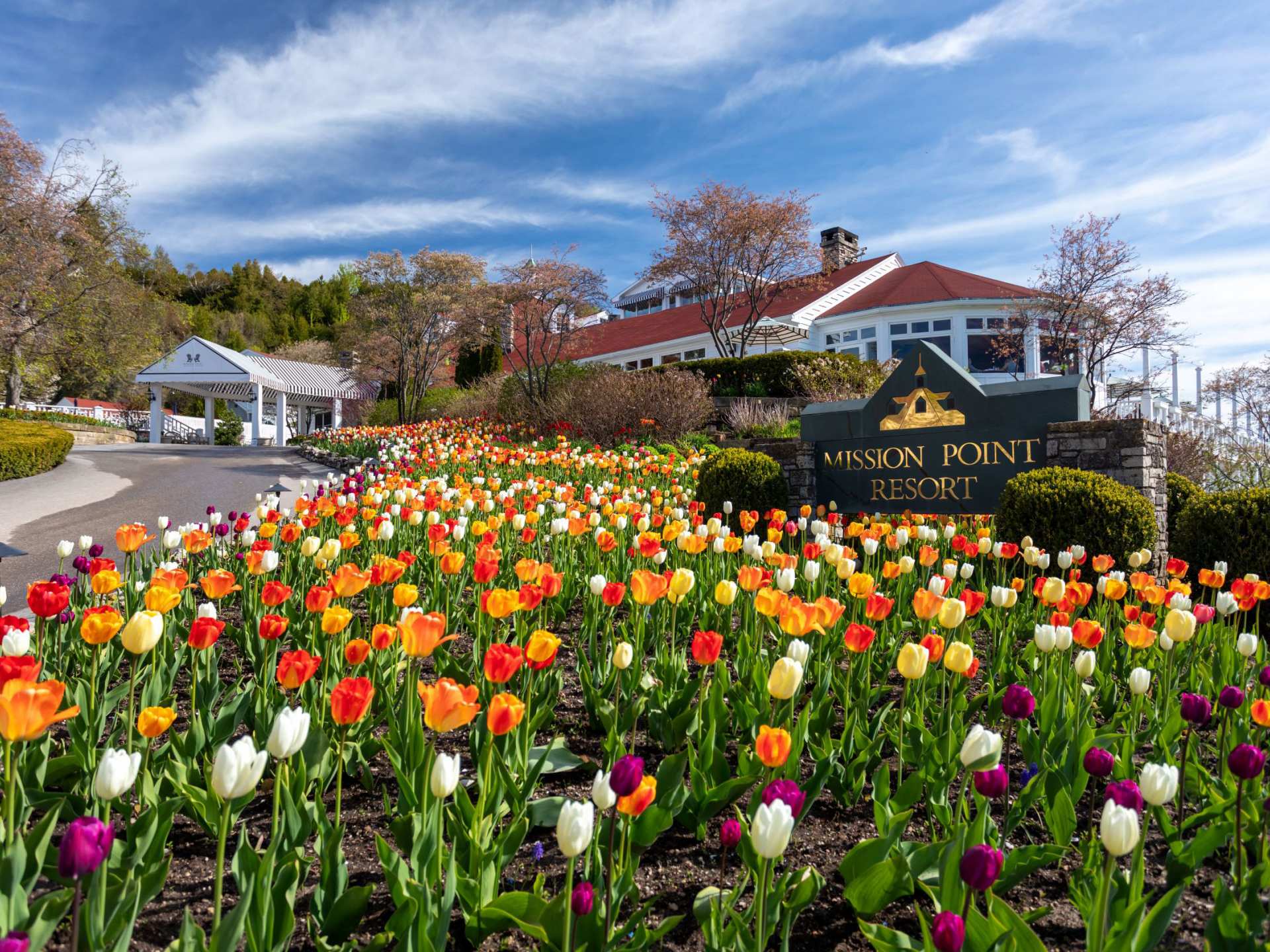 Mackinac Island | The sign for Mission Point resort with an array of tulips