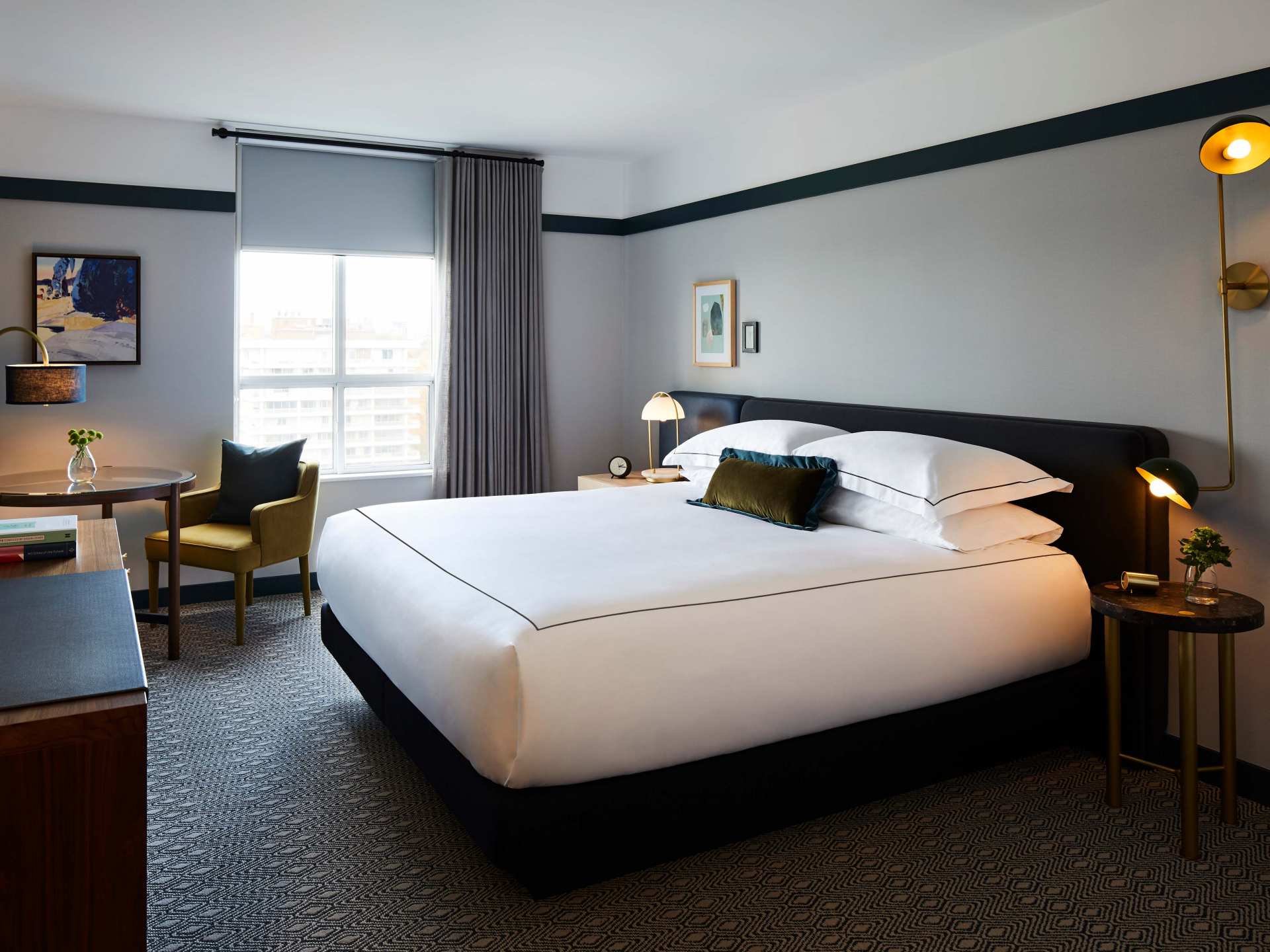 A suite at the Kimpton Saint George hotel with a king-sized bed