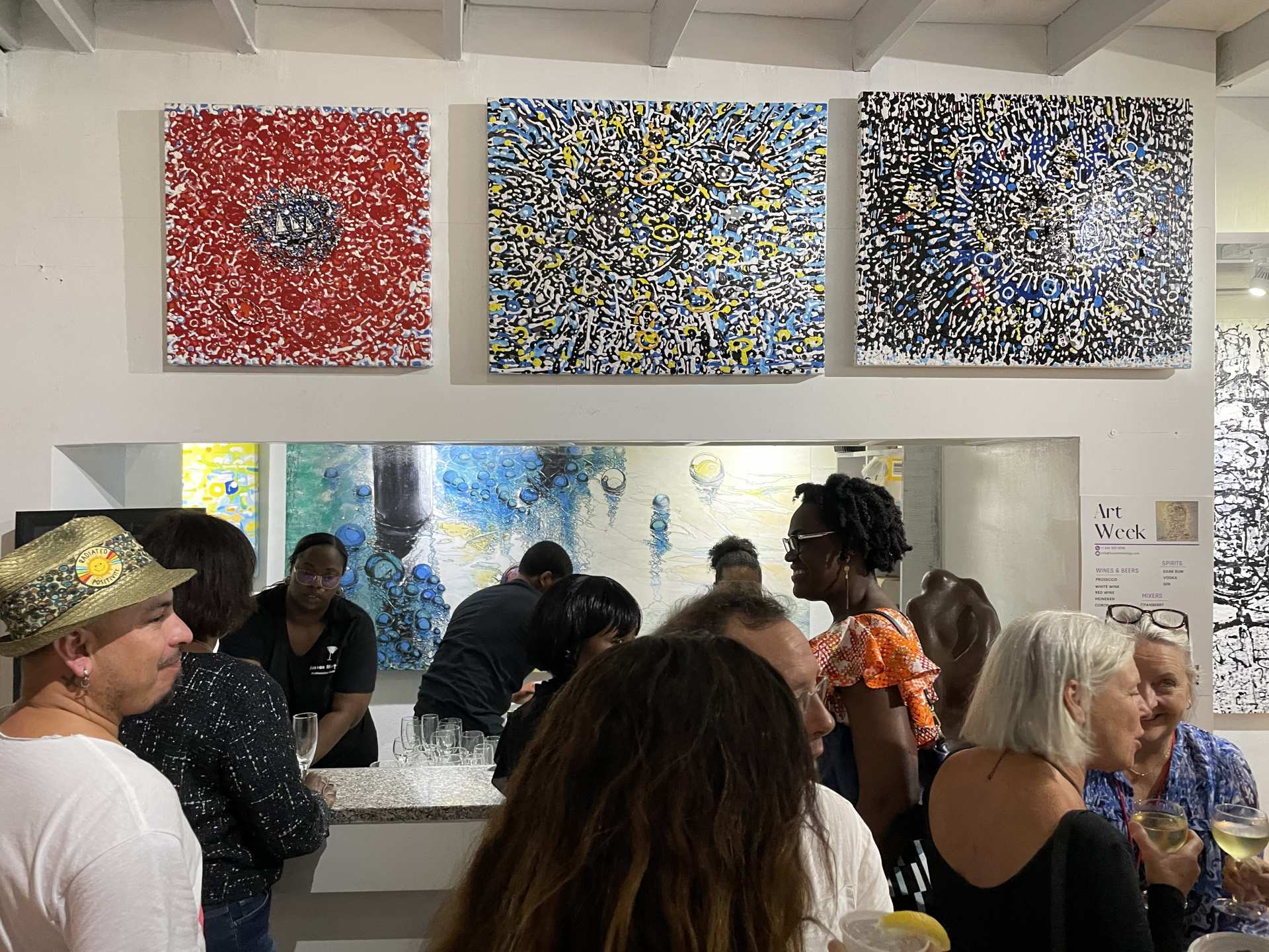Artists and art pieces in a gallery in the Cayman Islands