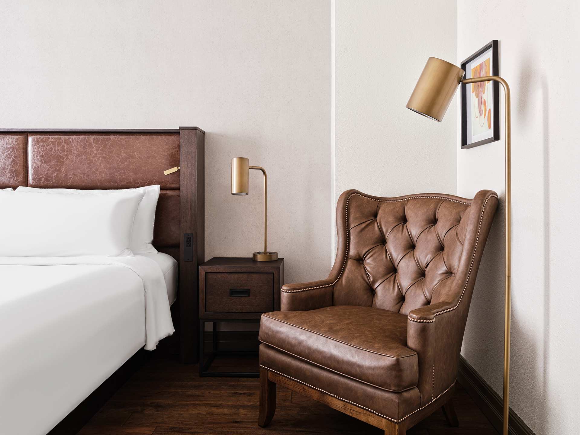 The Metcalfe hotel | The bed, side table and lounge chair at The Metcalfe