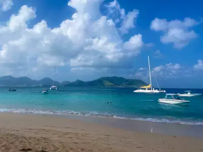 Saint Martin | Boats sail around Pinel Island