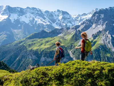 Switzerland Swiss Travel Pass | Two hikers at M&uuml;rren-Schilthorn