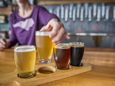 North Carolina | A person holding a glass of beer in Asheville, North Carolina