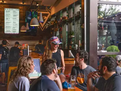 North Carolina | Group sitting at a table at DSSOLVR brewery in downtown Asheville, North Carolina